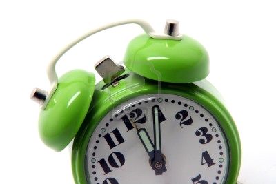 2983485-small-green-alarm-clock-at-twelve-oclock-isolated-on-white-background.jpg